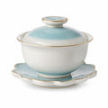 Porzellan-Teetasse mit Deckel und Untertasse Blau-Weiß